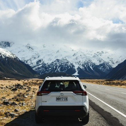 White car on the side of the road in New Zealand. Instant Finance Vehicle Loans